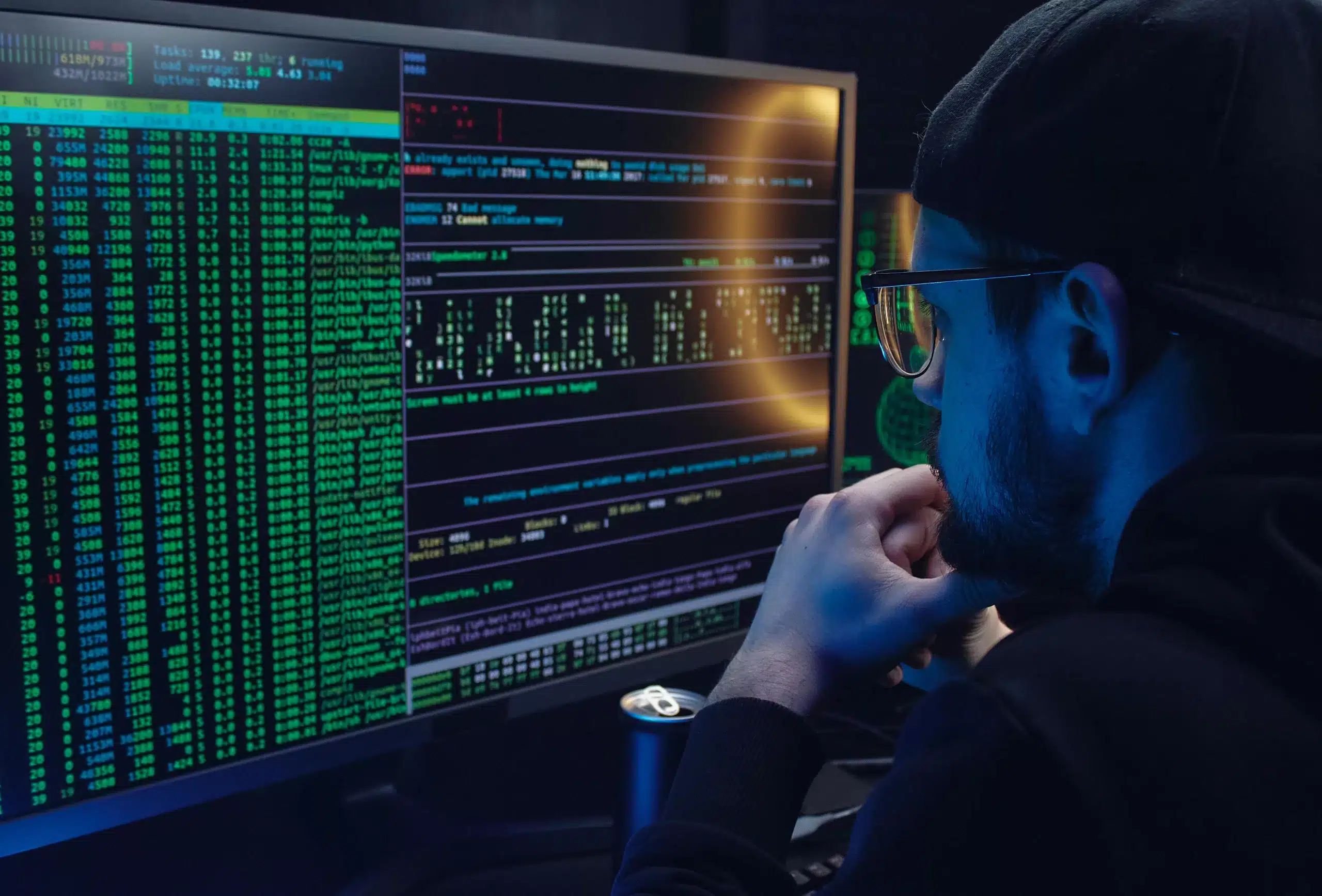 Man working on his computer with glasses